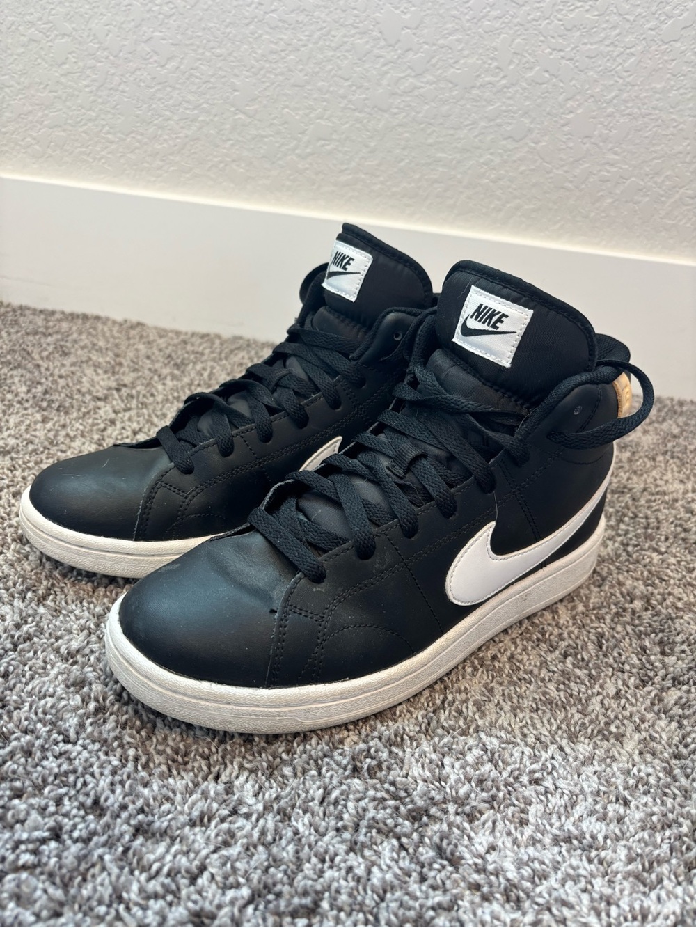 Nike Women’s Black High-Top Sneakers with White Swoosh Accent